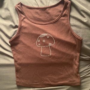Brown tank top with rhinestone mushroom on the front.